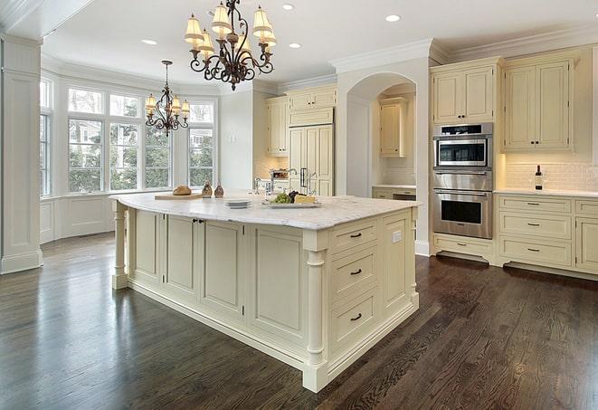 a modern kitchen with newly installed laminate flooring in Kealakekua